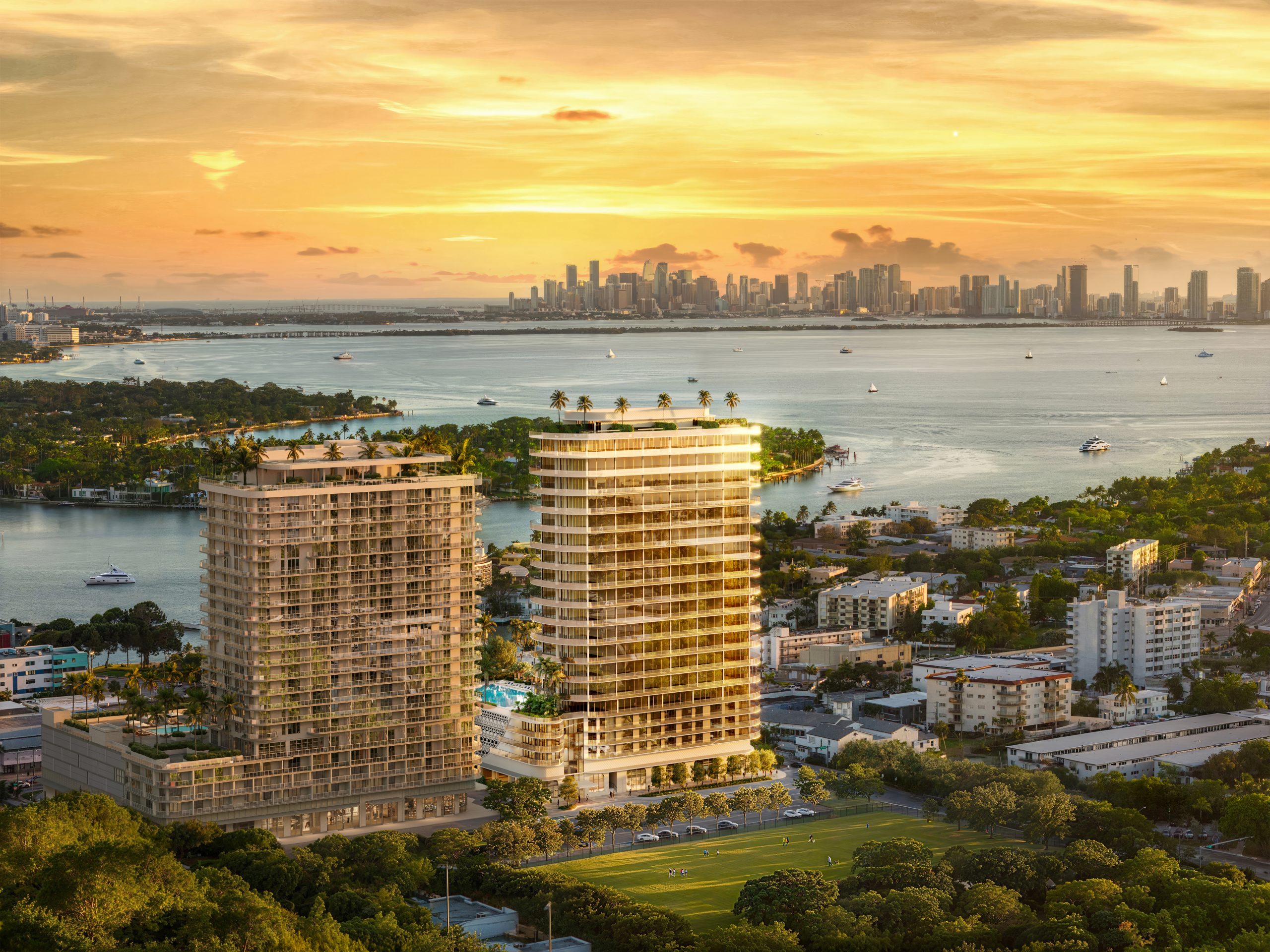 Aerial sunset view of PALMA Miami Beach with the Miami skyline across Biscayne Bay