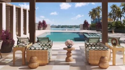 Covered poolside lounge with rattan furniture overlooking the marina at PALMA Miami Beach