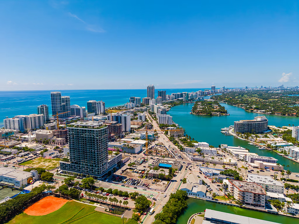 Aerial view of North Beach's coastline and waterway with condo towers under construction
