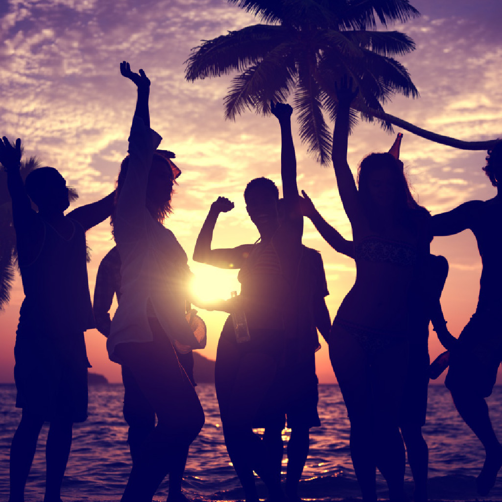 people dancing on a beach