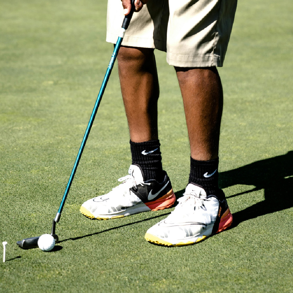 person golfing